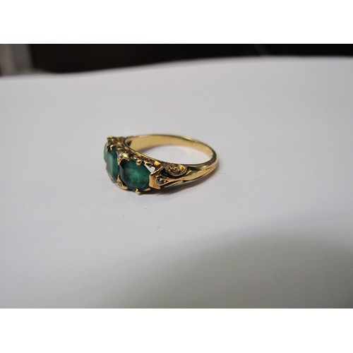 316 - A three stone emerald ring set in yellow metal.  Ring size M & 1/2.  Approx weight 4.8 grams.
(B.P. ... 