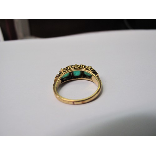 316 - A three stone emerald ring set in yellow metal.  Ring size M & 1/2.  Approx weight 4.8 grams.
(B.P. ... 