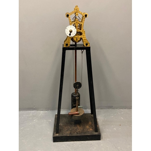 90 - An unusual, thought to be a prototype, skeleton clock with engine turned brass frame, enamelled face... 