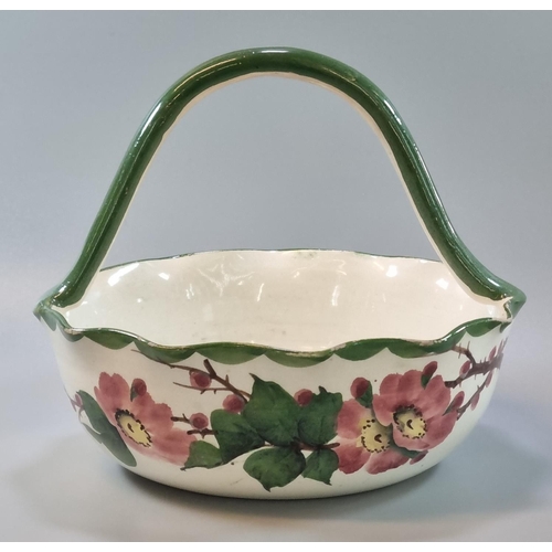 166 - 19th Century Llanelly pottery Shufflebotham wild rose fruit basket with high loop handle. 21cm diame... 