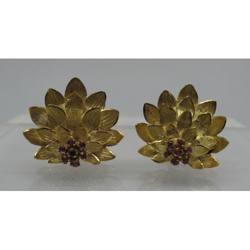 328 - A pair of 18ct gold and ruby lotus flower earrings with clip fittings.  Approx weight 10.5g.  
(B.P.... 