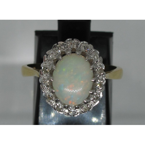 368 - 18ct opal and diamond ring.  Ring size M&1/2.  Approx weight 4.5 grams.
(B.P. 21% + VAT)