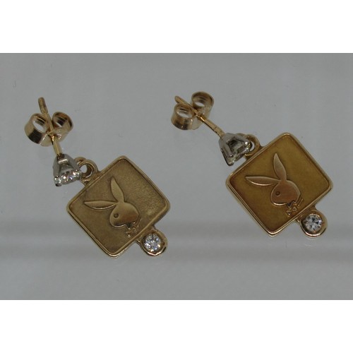 387 - A 14ct gold and diamond, 'Playboy' earring together with another in 9ct gold.  Approx weight 3.8 gra... 