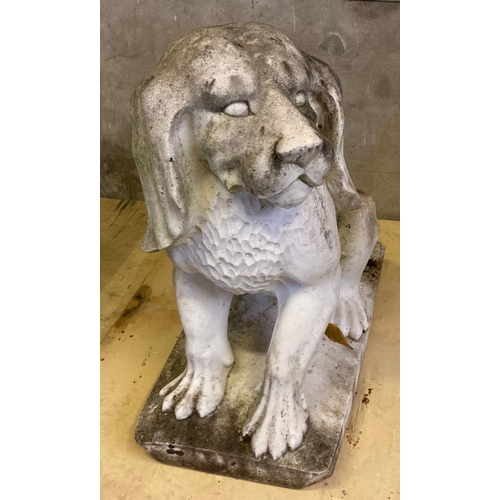 460 - Large Weathered marble garden statue in the form of a stylised seated hound dog.  71cm long, 74cm hi... 