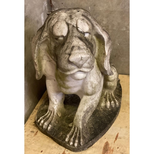 462 - Large weathered marble garden statue in the form of a stylised seated hound dog.  71cm long, 80cm hi... 