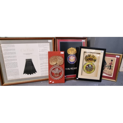 141 - A group of assorted framed items appertaining to the Royal Welsh Fusiliers including; 'The Flash', t... 