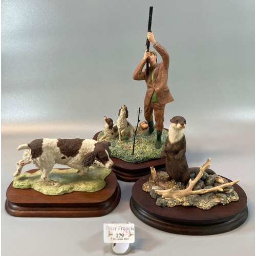 179 - Three Border Fine Arts sculptures to include: Retriever dog, otter and huntsman with rifle and dogs.... 