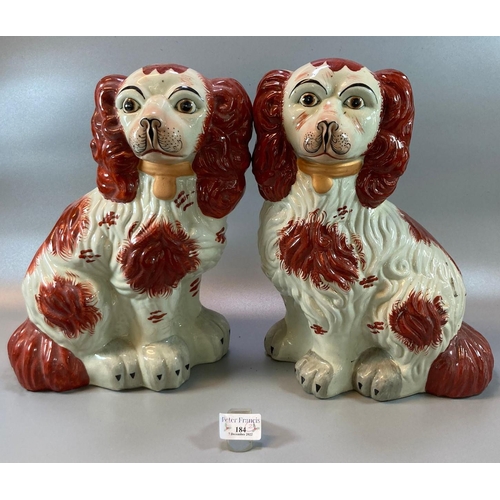 184 - Two similar Staffordshire style pottery fireside Spaniels with painted features. 
(B.P. 21% + VAT)