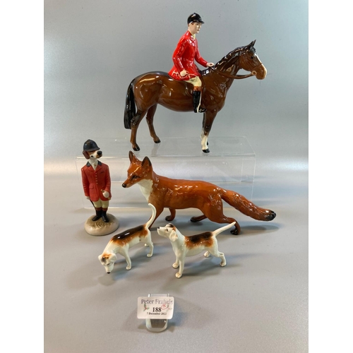 188 - Beswick huntsman on horse with black cap and red jacket, together with two Beswick hunting hounds, a... 