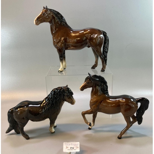 194 - Two Beswick horses together with a Beswick donkey.  (3)  (B.P. 21% + VAT)