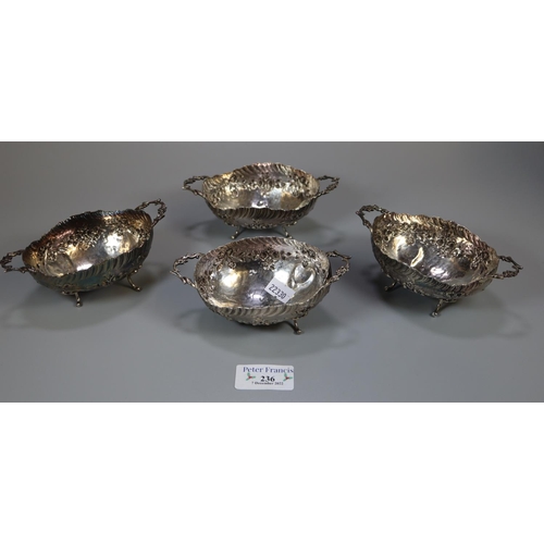 236 - Set of four 19th century silver two handled sweet meat dishes/bowls on out swept feet with repousse ... 