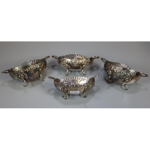 236 - Set of four 19th century silver two handled sweet meat dishes/bowls on out swept feet with repousse ... 