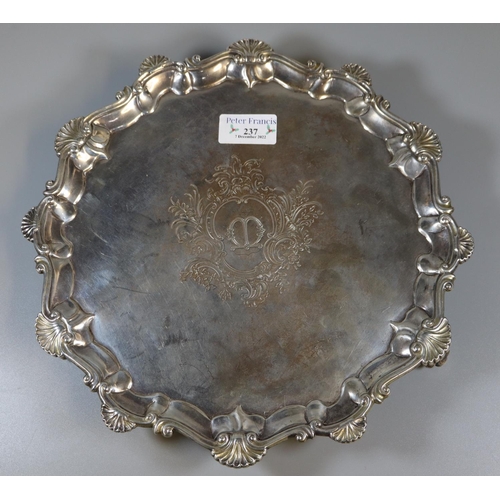 237 - 19th century silver pie crust salver, the border decorated with shells standing on three ball and cl... 