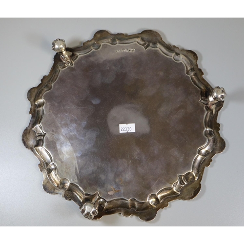 237 - 19th century silver pie crust salver, the border decorated with shells standing on three ball and cl... 