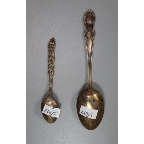 238 - Two silver commemorative spoons, one marked 'Here We Rest', together with a white metal beaker.  (B.... 