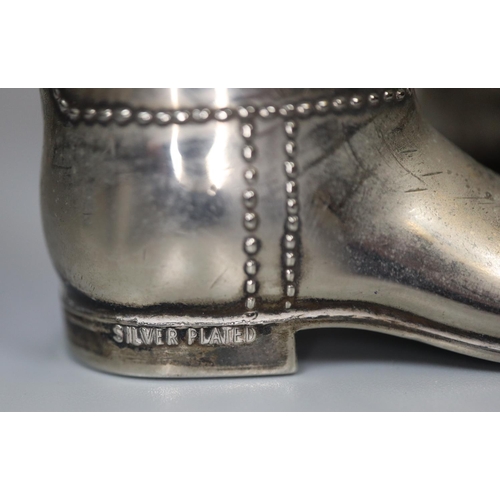 246 - Pair of miniature silver plated stirrup cups in the form of riding boots.  (B.P. 21% + VAT)