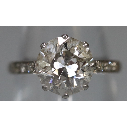 289 - A 2ct diamond solitaire ring set in platinum with scrolled shoulders. Estimated diamond weight 2cts.... 