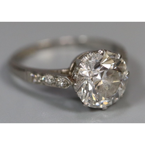 289 - A 2ct diamond solitaire ring set in platinum with scrolled shoulders. Estimated diamond weight 2cts.... 