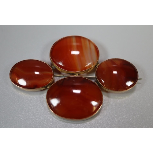 358 - 9ct gold mounted four panel agate pin brooch.
(B.P. 21% + VAT)