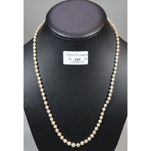 359 - Graduated string of cultured and simulated pearl beads.
(B.P. 21% + VAT)