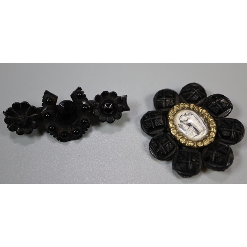 364 - Two Victorian black pin brooches. 
(B.P. 21% + VAT)