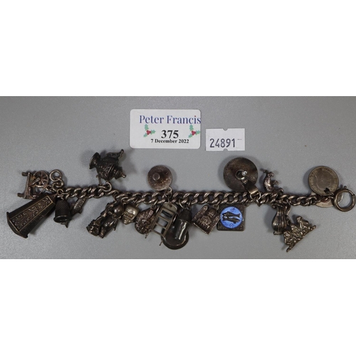 375 - Silver charm bracelet with various charms.
(B.P. 21% + VAT)