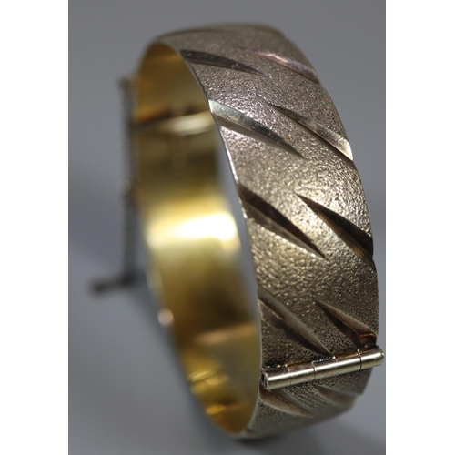 376 - Silver gilt hinged bangle. 1.3 troy ozs approx. 
(B.P. 21% + VAT)