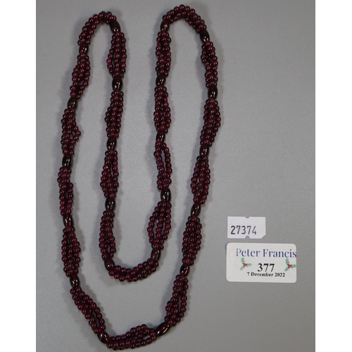 377 - Garnet bead triple strand necklace. 
(B.P. 21% + VAT)