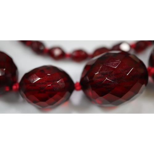 383 - Graduated string of red prismatic cut beads.
(B.P. 21% + VAT)