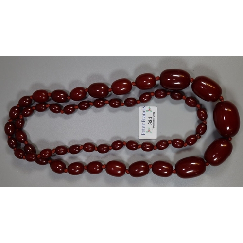 384 - Heavy dark red long string of graduated beads.
(B.P. 21% + VAT)