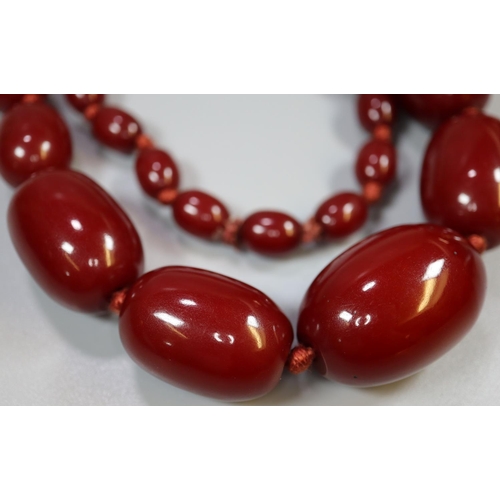 384 - Heavy dark red long string of graduated beads.
(B.P. 21% + VAT)