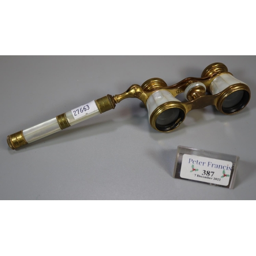 387 - Pair of probably French gilt metal and mother of pearl opera glasses. 
(B.P. 21% + VAT)