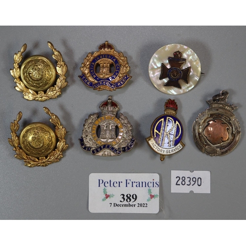 389 - Small collection of military pin badges and fobs etc. To include; The Suffolk Regiment and others. 
... 