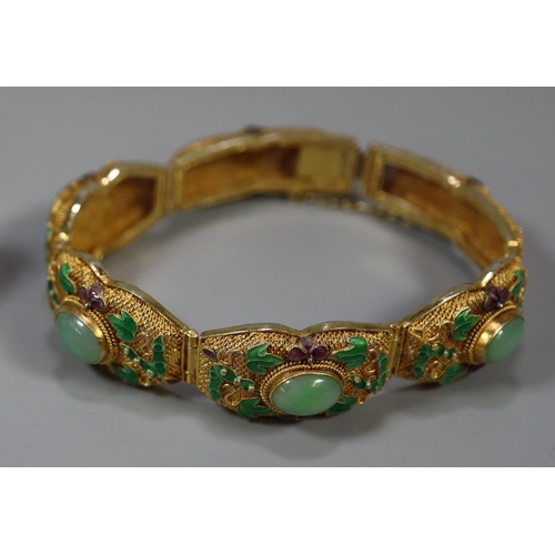 396 - Chinese design gilt metal hardstone set panel bracelet in original box. 
(B.P. 21% + VAT)