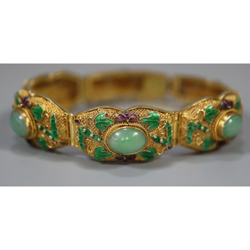 396 - Chinese design gilt metal hardstone set panel bracelet in original box. 
(B.P. 21% + VAT)