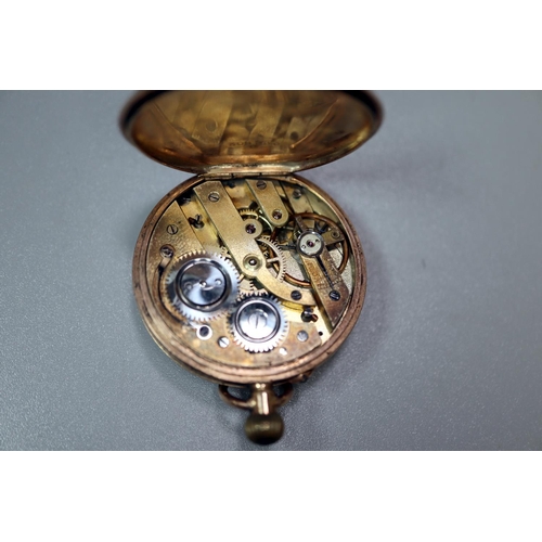 417 - 9ct gold inner and outer cased lady's fancy fob watch with foliate chased decoration and Roman numer... 