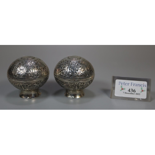 436 - Pair of Indian silver foliate decorated globular lidded salts on pedestal bases.  (2)  3.4 troy ozs ... 