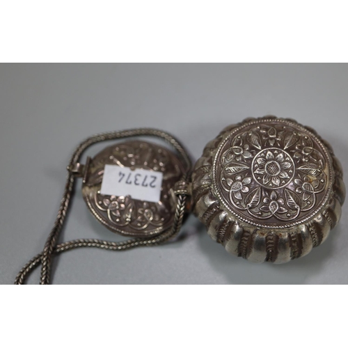 440 - Indian white metal repousse decorated cushion shaped box on chain.  2.9 troy ozs approx.   (B.P. 21%... 