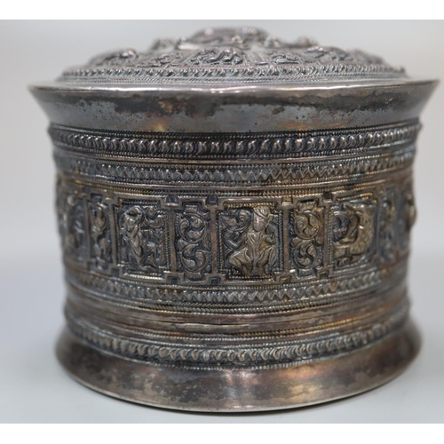 441 - Indian silver drum shaped repousse decorated box, overall with animals and geometric bands.  5 troy ... 