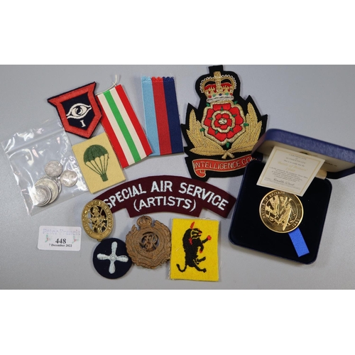 448 - Plastic box of GB silver coins and military items, to include: boxed medallions, uniform patches, ca... 