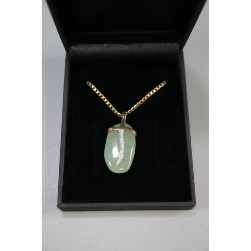 454 - 9K jade and gold pendant with 9ct gold chain, with COA.
(B.P. 21% + VAT)