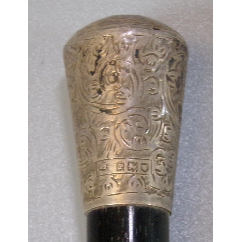 46 - Silver mounted and ebonised conductors baton or swagger stick. London hallmarks.  (B.P. 21% + VAT)