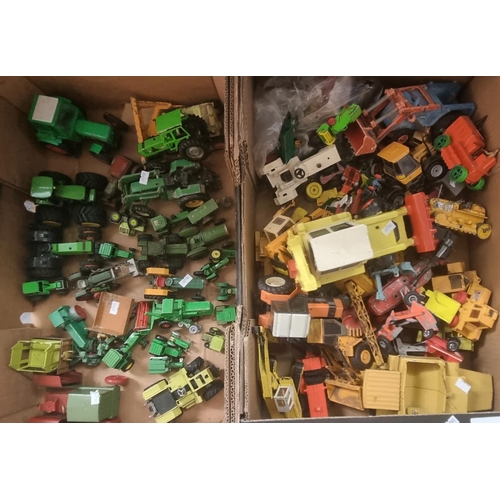 555 - Two boxes of playworn diecast and other model tractors and similar agricultural vehicles.  (2)   (B.... 