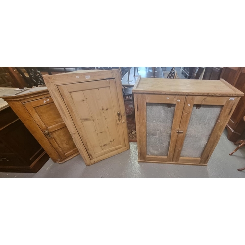 693 - Two similar pine farmhouse Victorian single door blind panelled hanging corner cupboards together wi... 