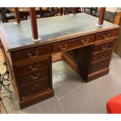 694 - Edwardian mahogany knee hole desk, the leather top above two pedestals with a bank of three drawers.... 