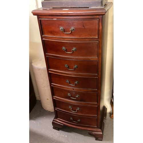 696 - Modern hardwood bow front seven drawer chest of narrow form on bracket feet.  (B.P. 21% + VAT)