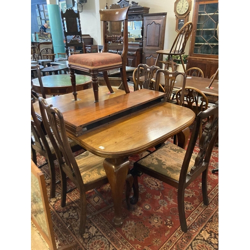 697 - Early 20th century mahogany extending dining table with two additional leaves and a collection of va... 