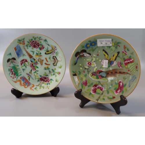 70 - Two similar Chinese porcelain Famille rose dishes on a celadon glaze decorated with birds, flowers, ... 