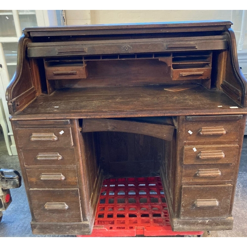 706 - Early 20th century oak 'S' roll knee hole desk.  (B.P. 21% + VAT)