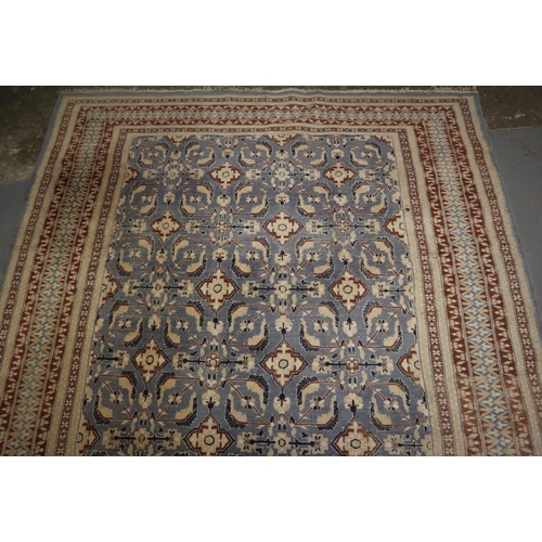 708 - Middle Eastern design blue ground carpet having central stylised floral and foliate panels with flow... 